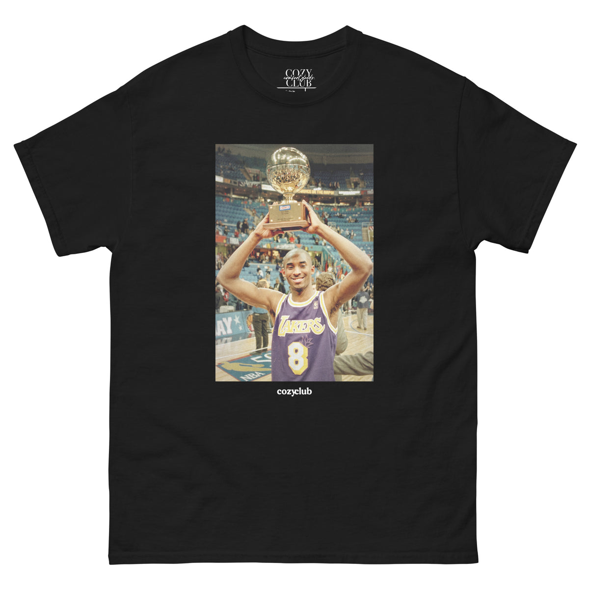 Back / Main Graphic Image:

Streetwear t-shirt featuring graphic print of rookie Kobe Bryant raising his 1997 NBA Slam Dunk Contest trophy wearing number 8 jersey

Front Chest Detail / Pocket Logo:

Close up front chest logo on Kobe Bryant 1997 Slam Dunk Contest graphic tee

Lifestyle / Model Shot:

Model wearing Kobe Bryant 1997 Slam Dunk Contest trophy streetwear graphic t-shirt

Flat Lay / Folded View:

Folded t-shirt displaying Kobe Bryant 1997 dunk contest graphic print and Cozy Club brand neck tag